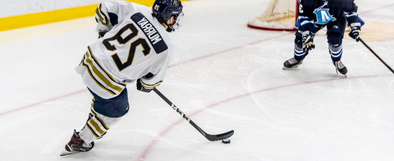 Trinity College mens Hockey player competing on ice